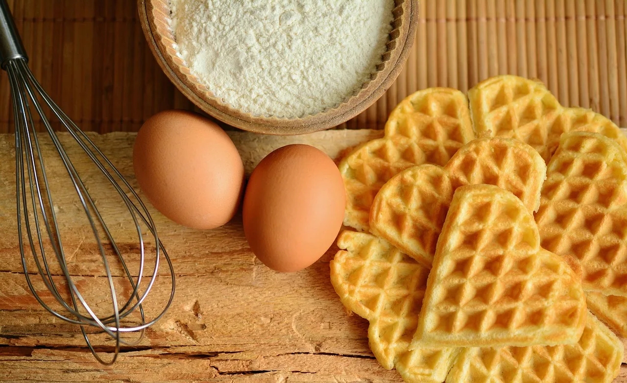 waffles, eggs, flour, whisk, wire whisk, baking ingredients, ingredients, food preparation, food, flat lay, composition, food phootgraphy, heart waffles, heart shape, raw eggs, waffles, eggs, food, food, food, food, food. Meal prep site selection by delivery radius and cold chain